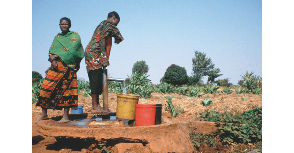 Pumping drinking water from a shallow groundwater source in Tanzania