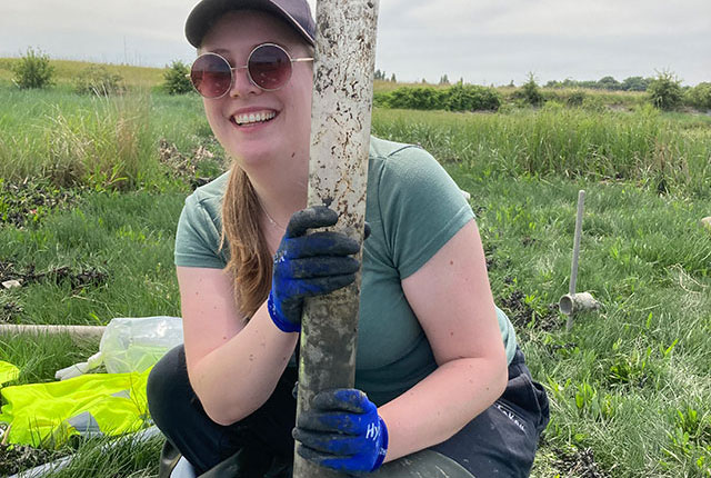 PhD student Megan Trusler (University of Nottingham) looking pleased to have recovered the first sediment core of the fieldtrip. Photo by Chris Vane. BGS © UKRI.