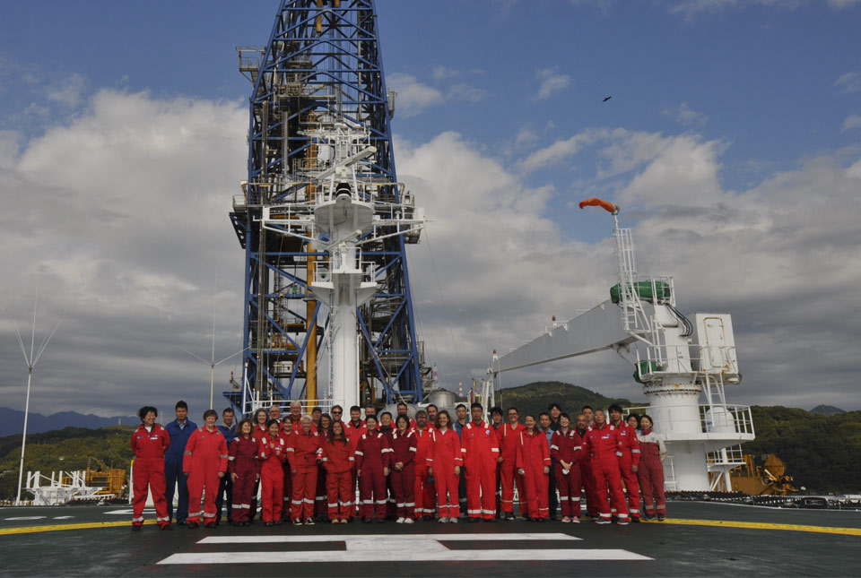 The ECORD IODP Expedition 386 Research Team on the helideck of The Chikyu research vessel.